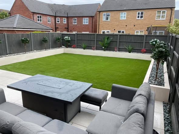 Modern Porcelain Patio with Artificial Grass and K Rend Walls - Blackpool