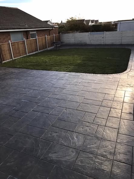 Large Ashlar Pattern Slate Grey Paving with New Fencing and Turf